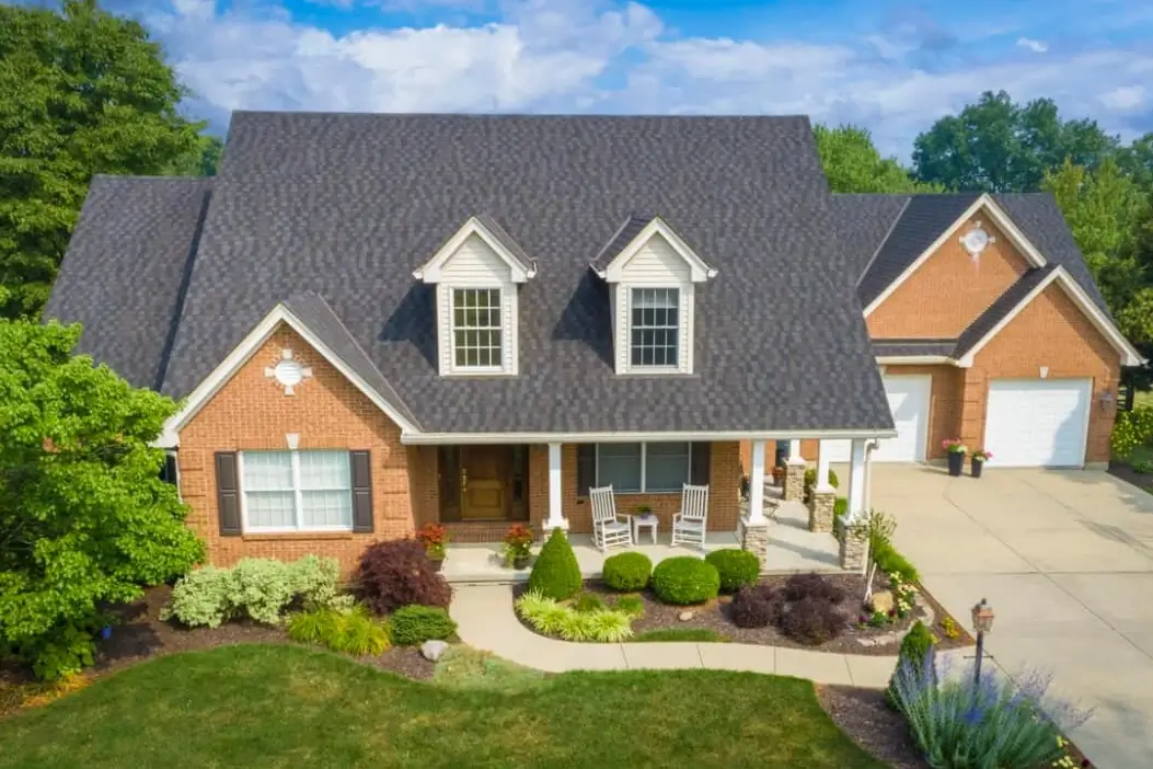 Aerial drone photo of home with beautiful new roof by Rosemeyer Roofing LLC