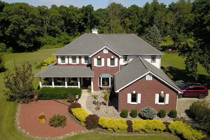 residential home with new roof by Rosemeyer Roofing LLC